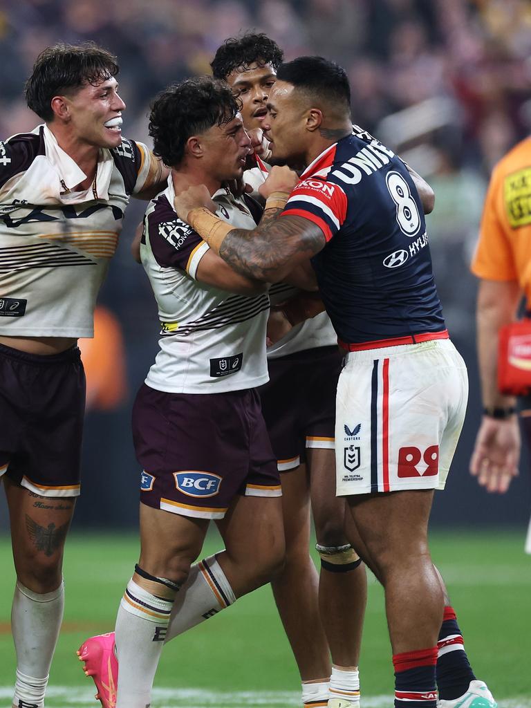 Broncos players went after Leniu. (Photo by Ezra Shaw/Getty Images)