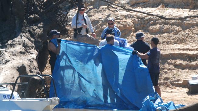 Victorian police divers search the Murray River for a missing boy on Friday, March 3, 2017, in Moama, New South Wales, Australia. Picture: Hamish Blair