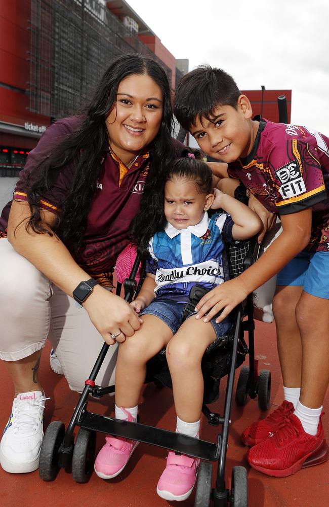 Leilani Holt, Eli-Ray Holt, 2, and Keanu Holt, 8, pictured at the Broncos v Rabbitohs, round 1, on Caxton Street, Brisbane 11th of March 2022. This is the first game for the BroncosÃ• season.