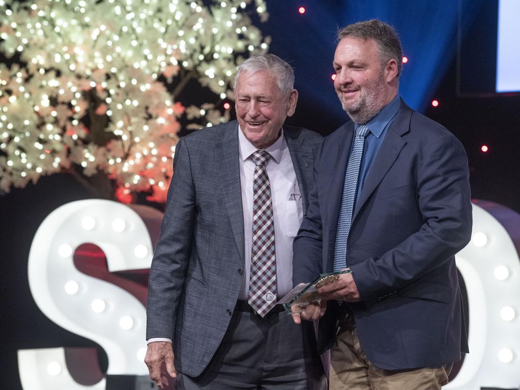 Stephen Koch, Principal Downlands College receives the Secondary School of the Year award from Clive Berghofer Land Sales. Sports Darling Downs Sports Stars of the Year dinner. Saturday, February 11, 2023. Picture: Nev Madsen.