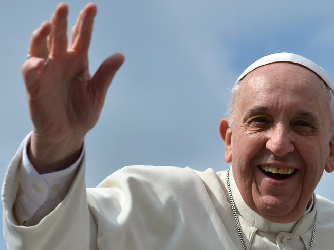 God welcomes all ... Pope Francis has pleased dog lovers everywhere. Picture: AFP