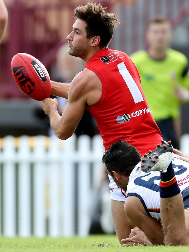 Aidan Tropiano handpasses away for North Adelaide, one of 28 disposals for the match. Picture Calum Robertson