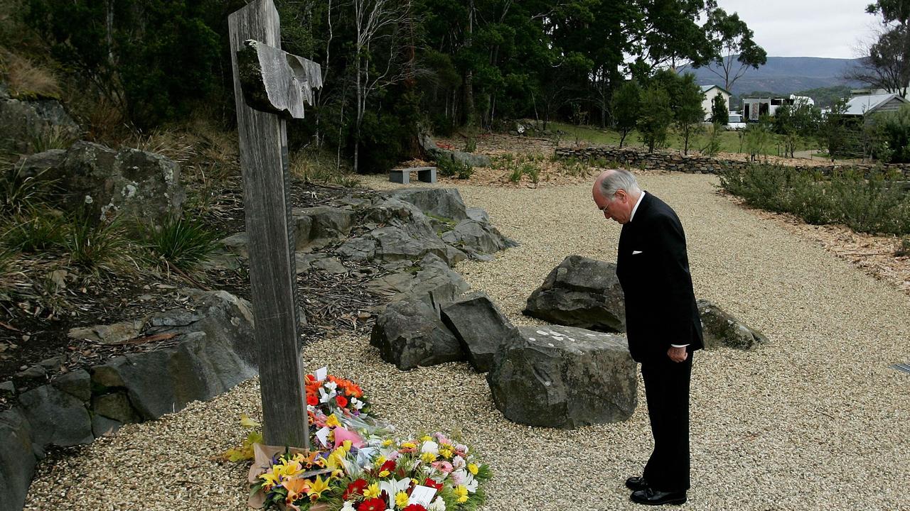 PM John Howard lays a wreath at the memorial cross site at Port Arthur during a service to mark the 10th aniversary of the 1996 massacre Apr 28 2006 Martin Bryant then 28yrs killed 35 people visiting the historical site and injured another 25. (PicIan/Waldie /Getty /Images) memorials tributes