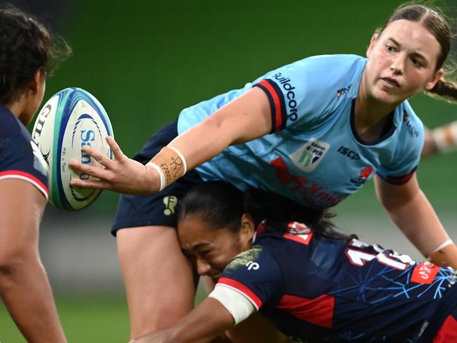 MELBOURNE, AUSTRALIA - APRIL 21: Caitlyn Halse of the Waratahs passes the ball during the Super W match between Melbourne Rebels Women and NSW Waratahs Women at AAMI Park, on April 21, 2023, in Melbourne, Australia. (Photo by Quinn Rooney/Getty Images)