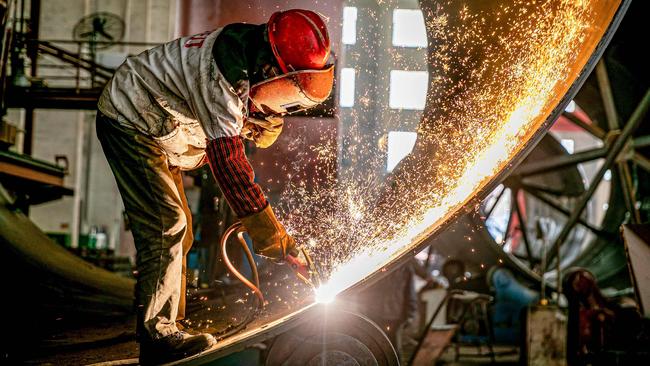 A worker produces engineering equipment for export at a factory in Nantong, in China’s eastern Jiangsu province. Picture: AFP