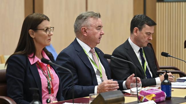 Tax Practitioners Board chair Peter de Cure, centre, appears before an inquiry into the integrity by consultancy services. Picture: Martin Ollman