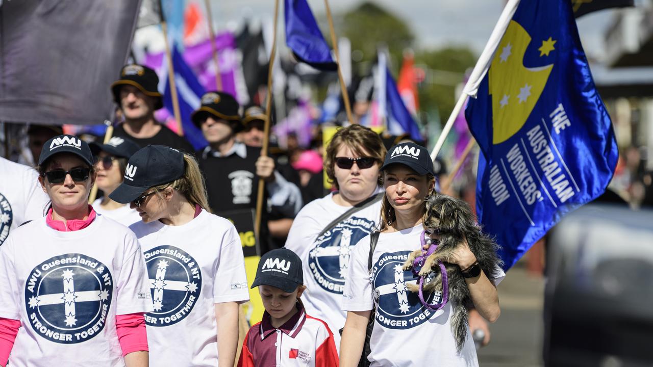 Alex Redding, holding Gigi, marches with the AWU in the Toowoomba Labour Day March, Saturday, May 3, 2025. Picture: Kevin Farmer