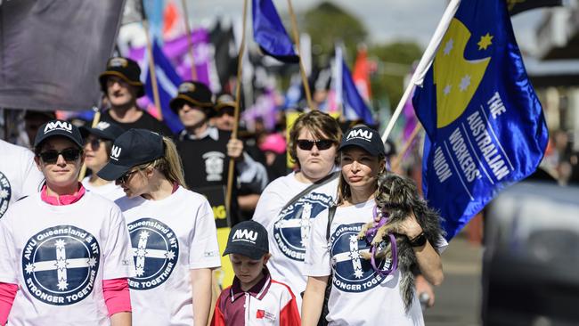 Alex Redding, holding Gigi, marches with the AWU in the Toowoomba Labour Day March, Saturday, May 3, 2025. Picture: Kevin Farmer