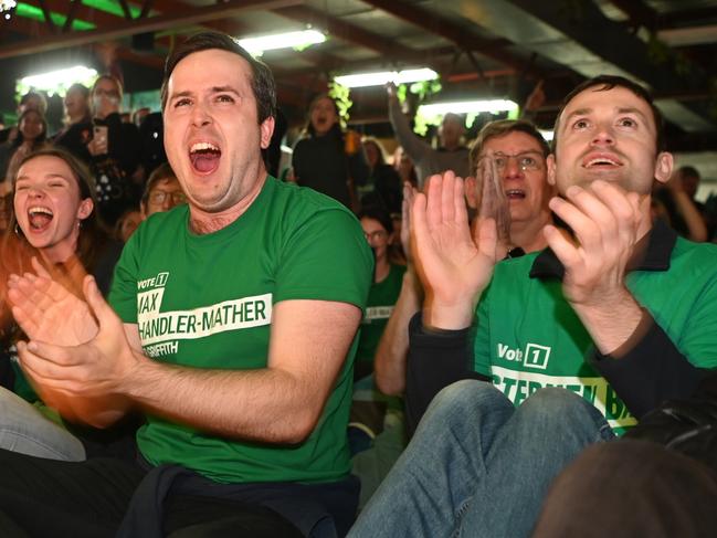 BRISBANE, AUSTRALIA - MAY 21:  Australian Greens volunteers react to favourable election results on May 21, 2022 in Brisbane, Australia. Australians have voted today to elect the 47th Parliament of Australia, with a tight battle between incumbent Prime Minister Scott Morrison of the Coalition party and Labor Leader, Anthony Albanese. The Coalition party has led government since 2013. (Photo by Dan Peled/Getty Images)