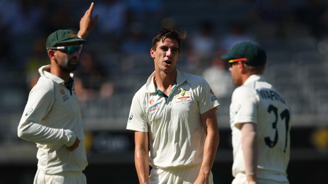 Nathan Lyon, Pat Cummins and David Warner after an unsuccessful appeal against Tom Latham. Picture: Getty Images