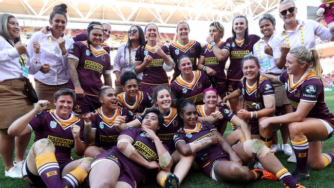 Broncos players celebrate their historic win over the Dragons at Suncorp Stadium. Picture: Liam Kidston.