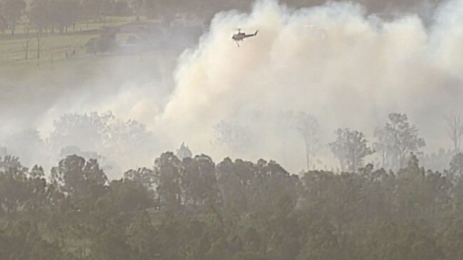 A bushfire burning in Beaudesert yesterday.