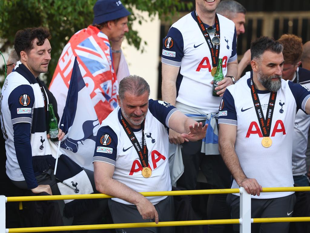 Tottenham Hotspur manager Ange Postecoglou waves to the fans from the victory bus. Picture: Getty Images