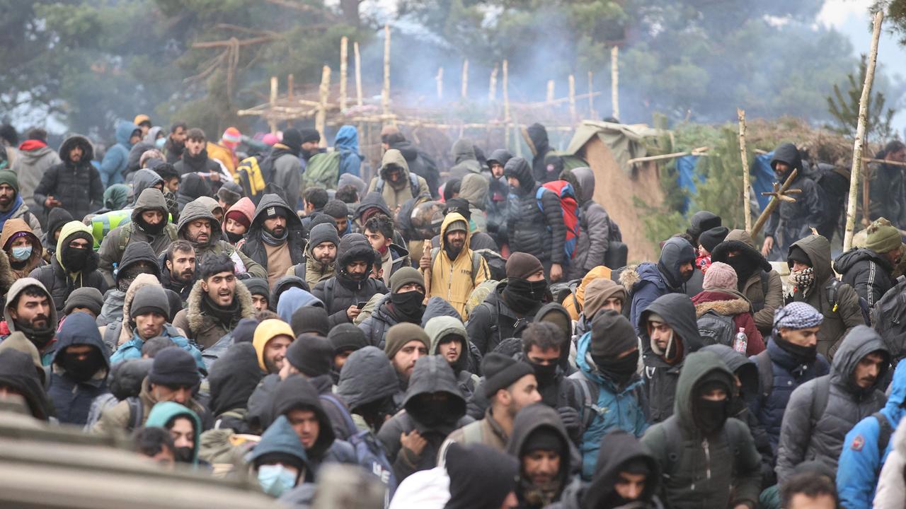 Desperate migrants huddle at the Polish-Belarusian border. Picture: Leonid Shcheglov/various sources/AFP