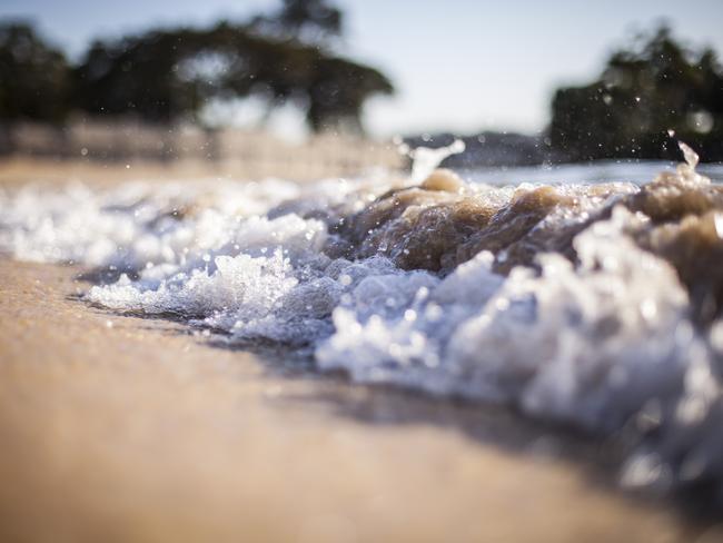 Sea bubbles on to sand at Balmoral. Picture: Chris Meredith.