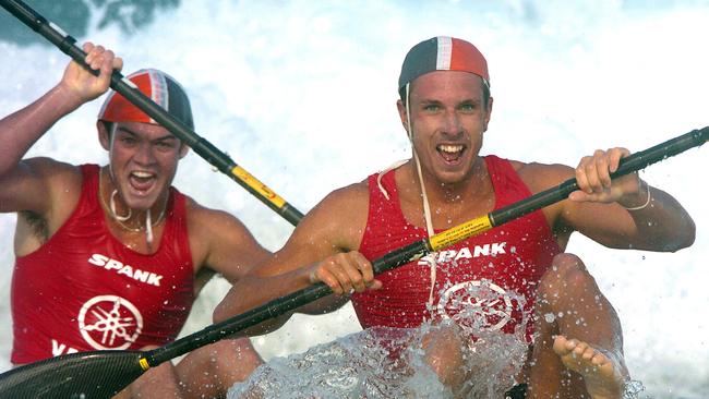 David Smith and Cameron Warren crossing the line to win the under 19 double ski race final at the Australian Surf Life saving Championships at Kurrawa beach, Gold Coast, in 2005. (AAP Image/Dave Hunt)