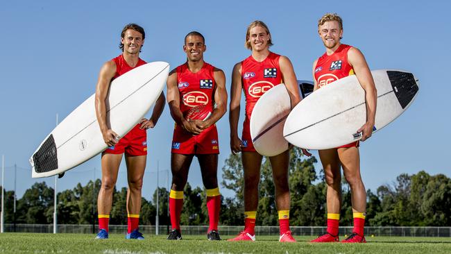 Surf’s up for Gold Coast Suns Lachie Weller, Touk Miller, Jeremy Sharp and Hugh Greenwood. Picture: Jerad Williams