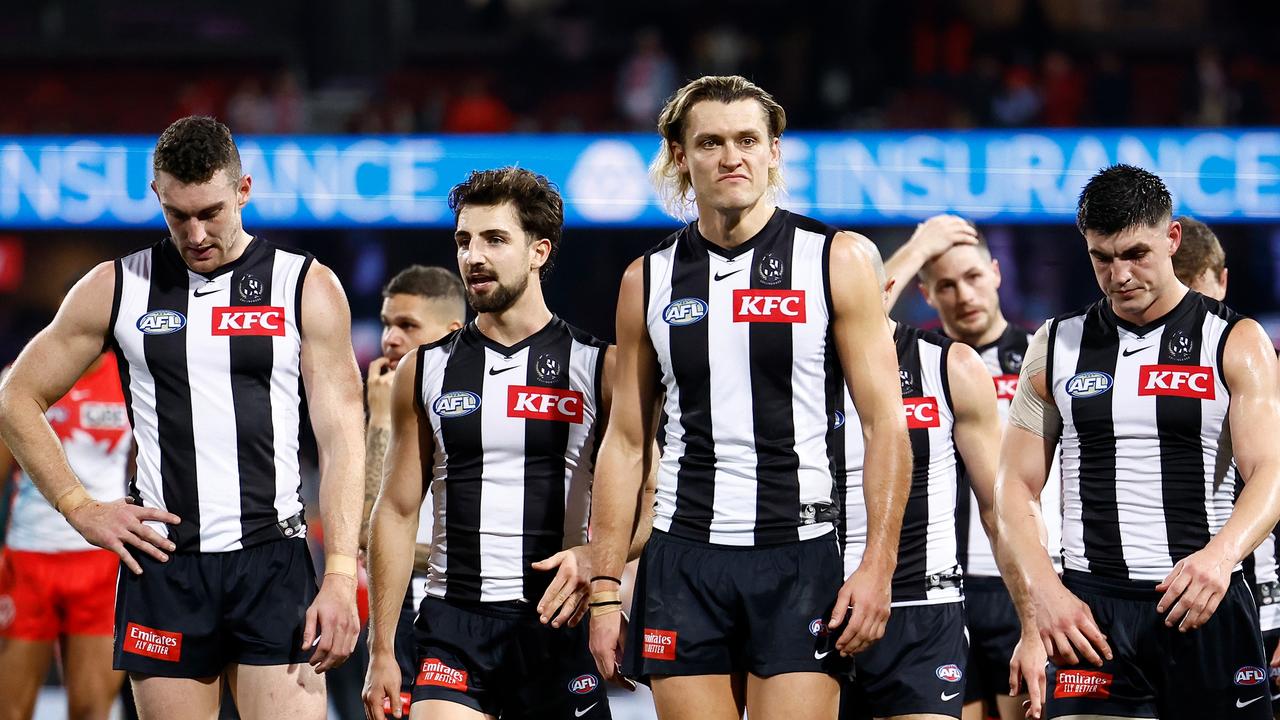 SYDNEY, AUSTRALIA - AUGUST 09: The Magpies look dejected after a loss during the 2024 AFL Round 22 match between the Sydney Swans and the Collingwood Magpies at The Sydney Cricket Ground on August 09, 2024 in Sydney, Australia. (Photo by Michael Willson/AFL Photos)