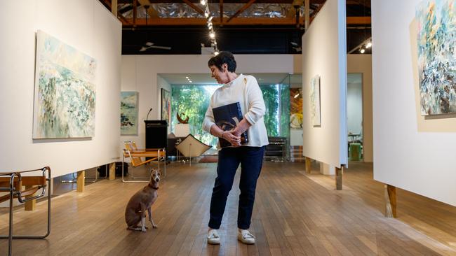 BMG Art director Trudyanne Brown, with her dog Lino, in her apartment/gallery on South Road. Picture: Matt Turner