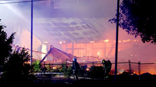 Multiple fire units spray water on buildings on fire in Hubert St, Gabba - on Wednesday 25th of September - Photo Steve Pohlner