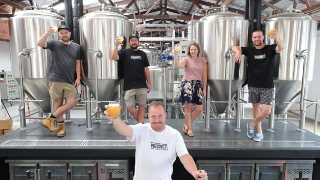 Precinct Brewing owners Jeremy James, Michael Craighead, Scott Imlach, Simone Tunbridge and Tom Welch toast to their opening. Picture: Glenn Hampson