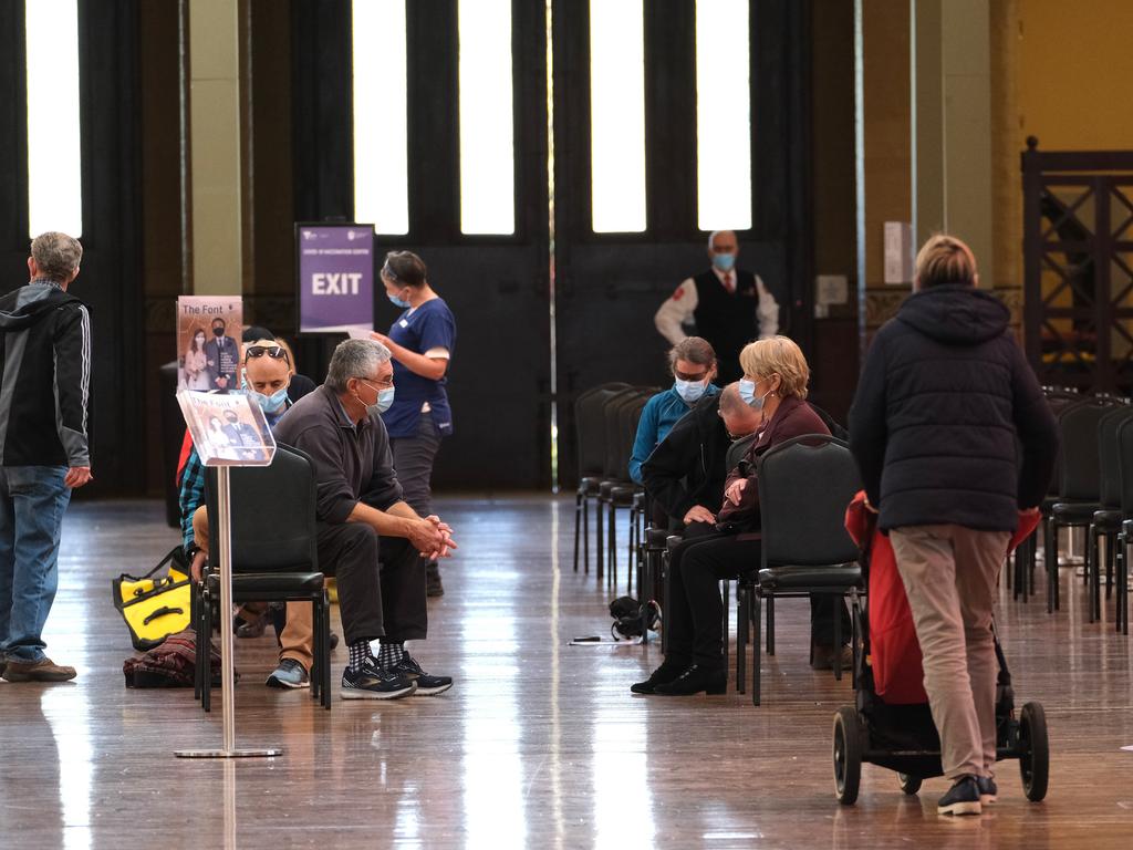 People attend the mass vaccination hub at the Royal Exhibition Building in Melbourne on Wednesday. Picture: Luis Ascui – Pool/Getty Images