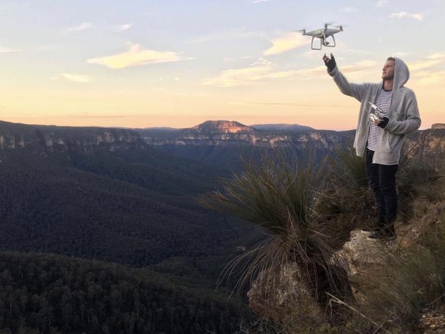 Mr Plummer with his drone in the Blue Mountains.