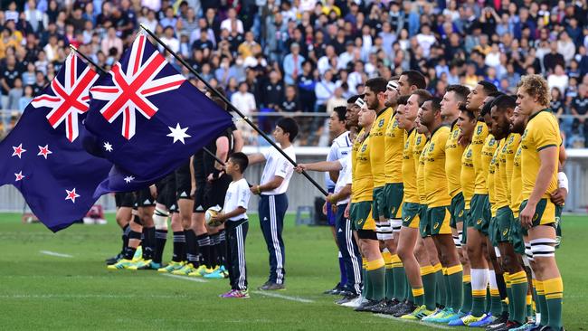 The Wallabies and All Blacks line up at Yokohama last year.