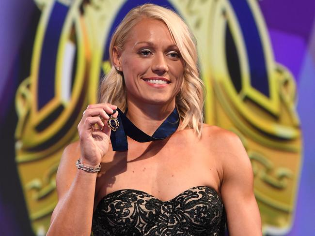 Adelaide Crows player Erin Phillips poses for photos with at the AFLW WomenÕs Best and Fairest award at Peninsula in Melbourne, Tuesday, March. 28, 2017. (AAP Image/Julian Smith) NO ARCHIVING