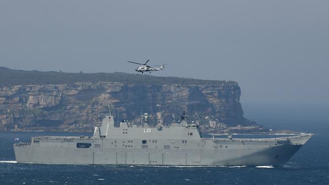 HMAS Adelaide is photographed from Gap Park in Watson Bay as it deploys to support the bushfire crisis. Picture: AAP