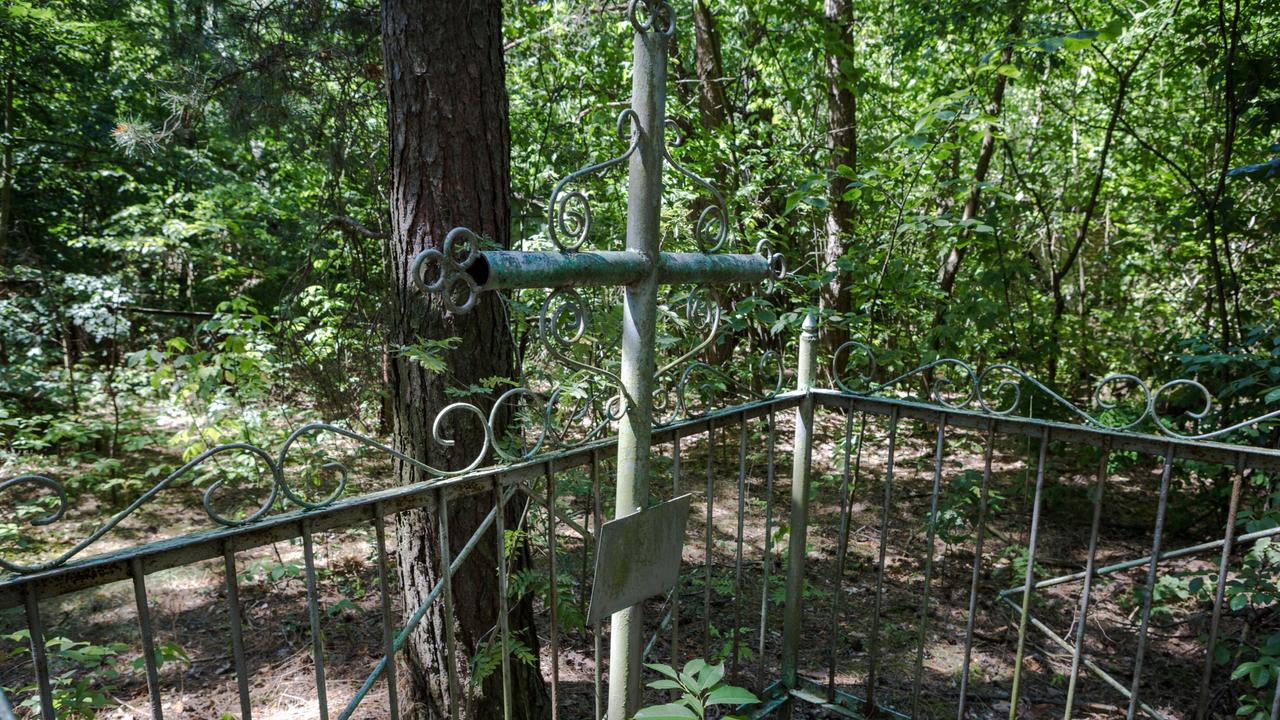 A cemetery in Pripyat where the dead lay abandoned, much like the town. Picture: Erwin Zwaan