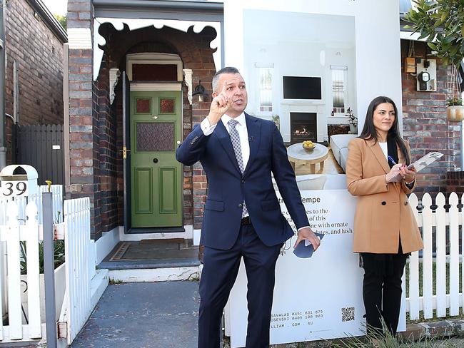 Auctioneer Clarence White mid auction at 9 Hart Street, Tempe. The winning bid from John Denny was $1.466M with four groups bidding and six registered. The reserve was $1.4M. Jane Dempster/The Daily Telegraph.