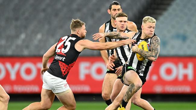 Jordan De Goey breaks away in last year’s ANZAC Day clash in front of empty stands. Picture: Quinn Rooney/Getty Images