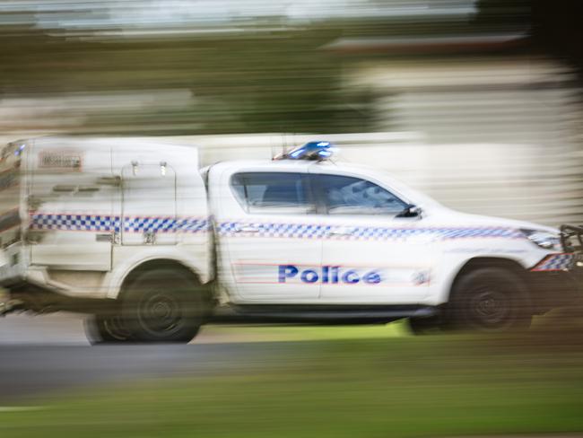 A police vehicle under lights and sirens on Ruthven St in Toowoomba, Wednesday, April 24, 2024. generic Queensland Police, QPS, police Picture: Kevin Farmer