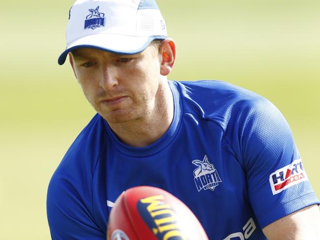 MELBOURNE, AUSTRALIA - DECEMBER 08: Jack Ziebell of the Kangaroos handballs during a North Melbourne Kangaroos AFL training session at Arden Street Ground on December 08, 2021 in Melbourne, Australia. (Photo by Darrian Traynor/Getty Images)