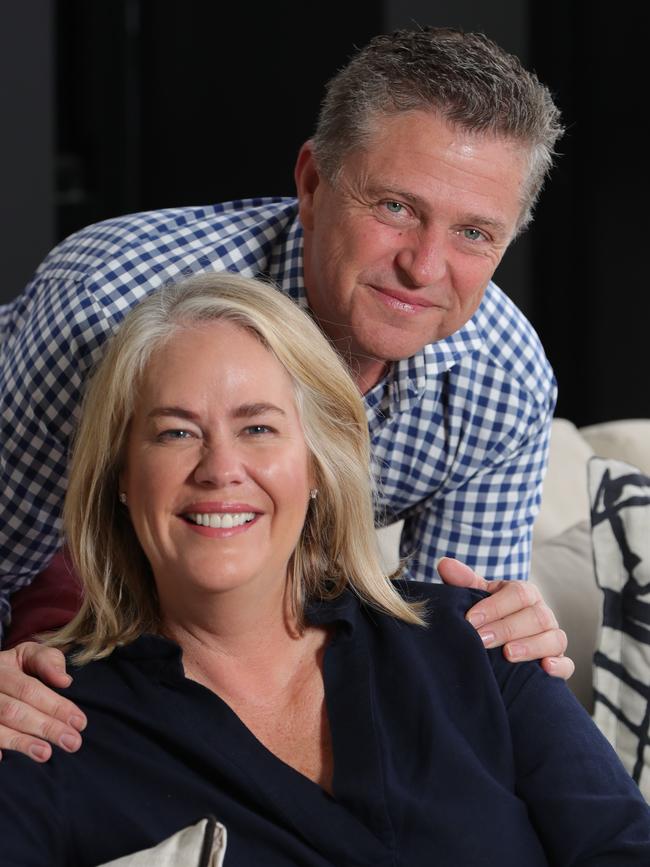 Rebecca and Brett Frizelle relaxing at their Southport home. Picture: Glenn Hampson