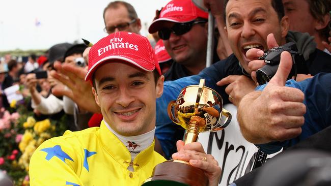 Christophe Lemaire with the 2011 Melbourne Cup trophy Picture: Quinn Rooney-Getty Images