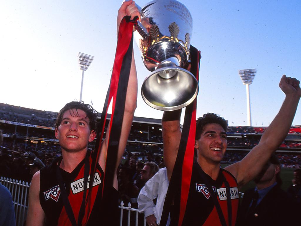 Ricky Olarenshaw (right, pictured with James Hird) celebrates winning the 1993 AFL grand final. Picture: Getty Images