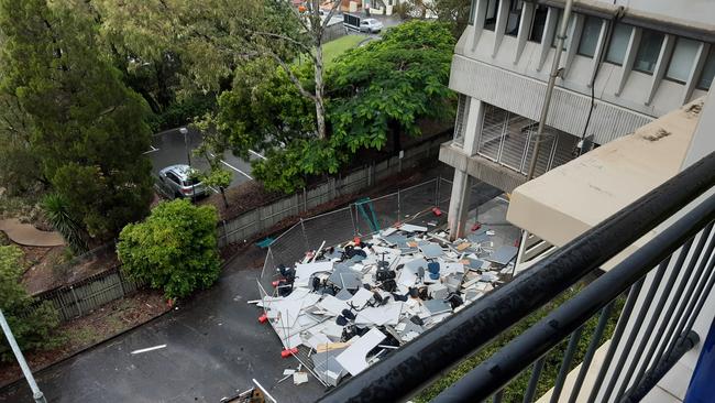 Office furniture and fittings thrown into a carpark during demolition preparation works for the old Energex building.