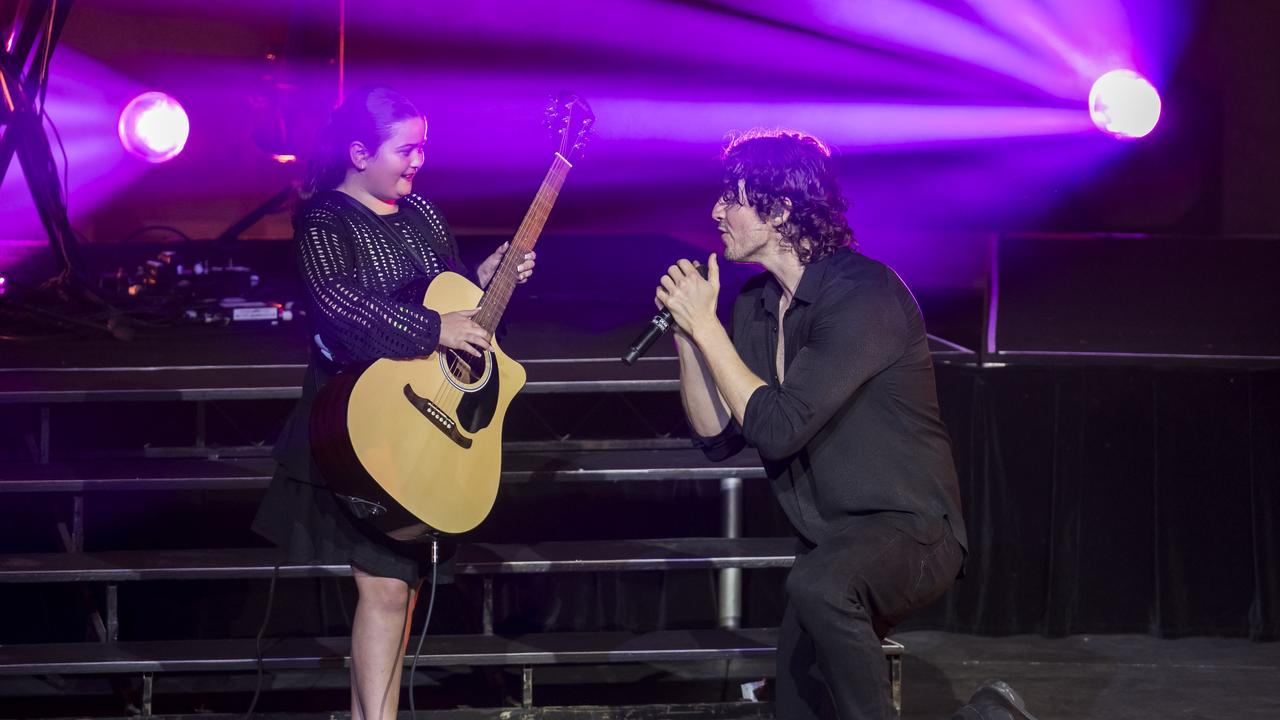 Ella Pedder 9 of Hobart on stage with Dean Lewis at MyState Bank Arena Hobart. Picture: Caroline Tan for Dean Lewis