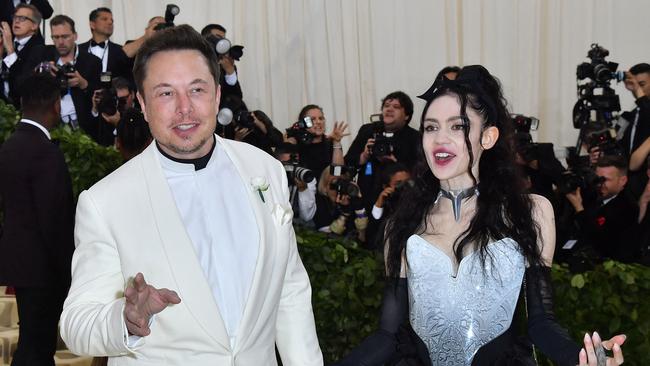 With the musician and his former partner Grimes in 2018. Picture: Angela Wiss/AFP