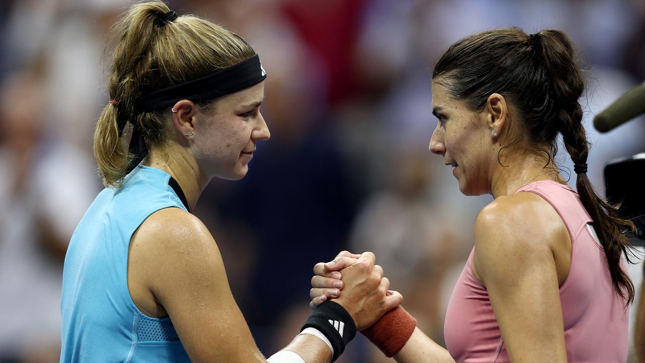 Karolina Muchova of Czech Republic (R) celebrates match point against Sorana Cirstea of Romania. (Photo by Elsa/Getty Images)