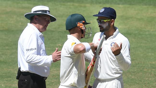 Australian batsman David Warner and Indian captain Virat Kohli exchange views at Adelaide Oval in 2014.