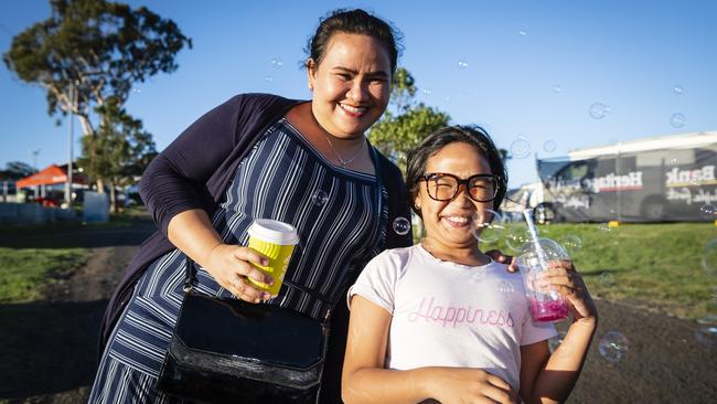 Haydee Lavers with daughter Chlouie Lavers plays with bubbles at Toowoomba Royal Show, Thursday, March 30, 2023. Picture: Kevin Farmer