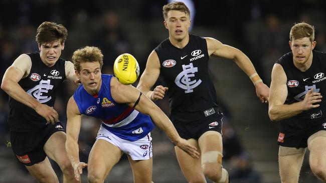 Mitch Wallis chases the loose footy. Picture: Michael Klein