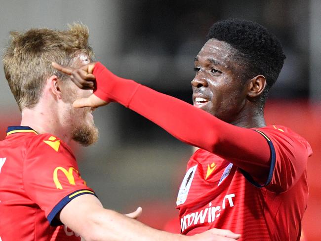 Al Hassan Toure of United celebrates a goal with Benjamin Halloran during the FFA Cup Quarter Final match between Adelaide United and the Newcastle Jets at Coopers Stadium in Adelaide, Tuesday, September 17, 2019. (AAP Image/David Mariuz) NO ARCHIVING, EDITORIAL USE ONLY
