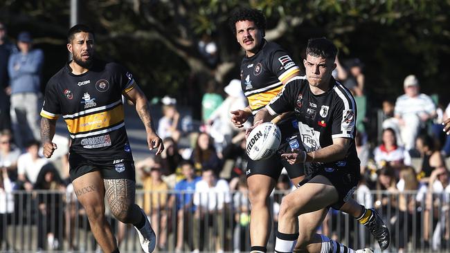 Redfern's Isaac Chapman throws a pass. Picture: John Appleyard