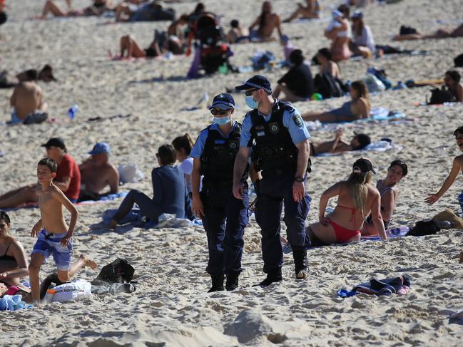 SYDNEY, AUSTRALIA - NewsWire Photos AUGUST 11, 2021 - Police patrols Bondi Beach as big crowds have flocked to the beach with today's beautiful weather. Picture: NCA NewsWire / Christian Gilles