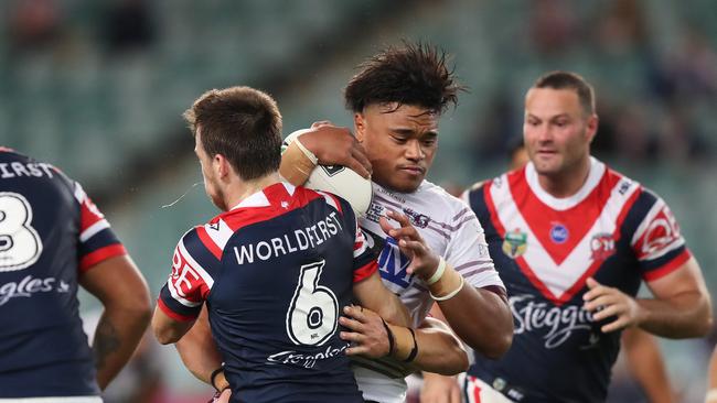 Manly's Moses Suli takes on the Sydney Roosters. Picture: Brett Costello