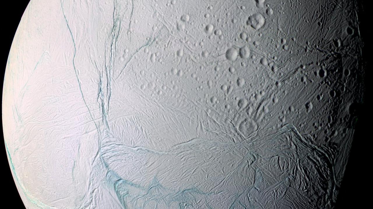 Saturn's moon Enceladus has an ocean beneath its surface. Picture: AFP/NASA.